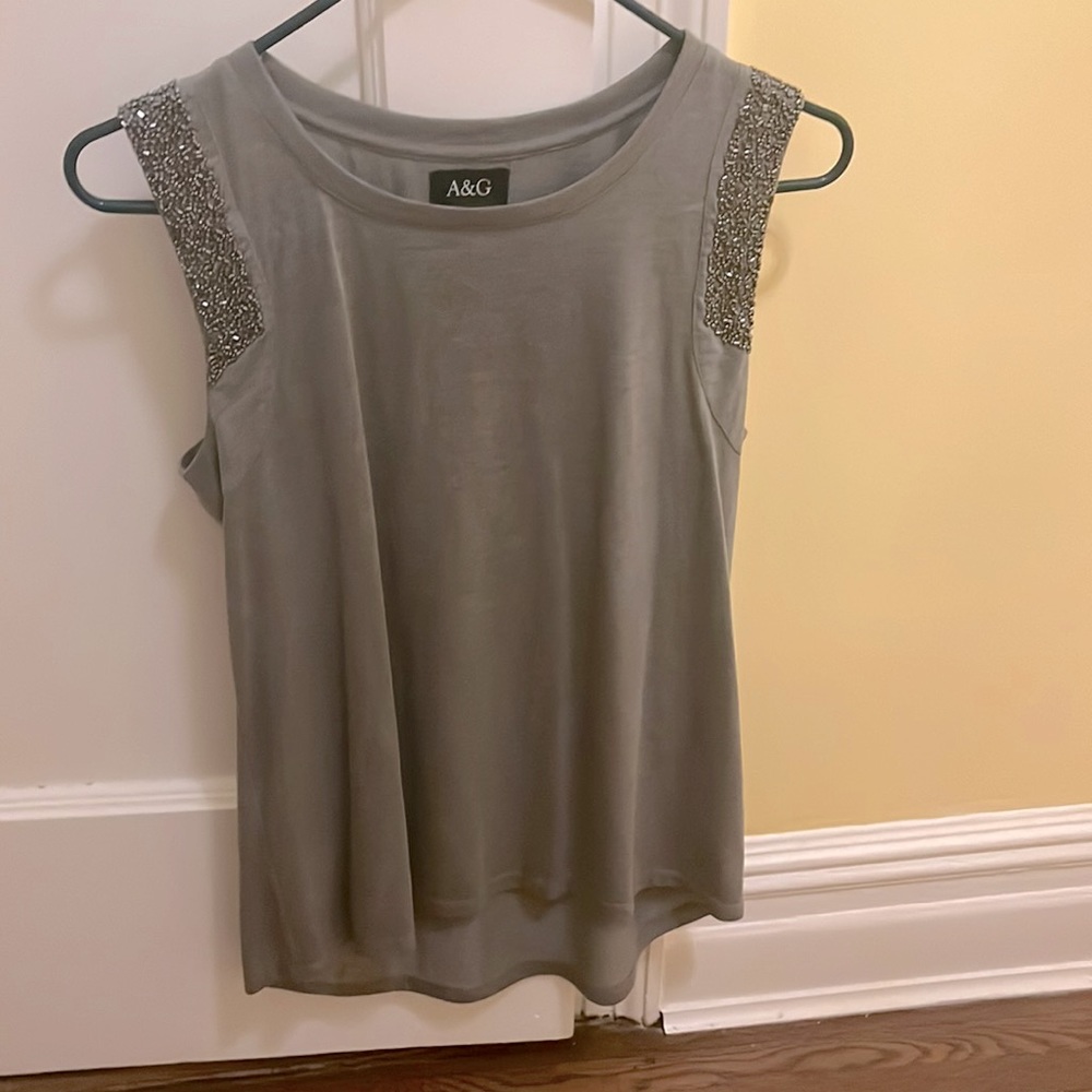 Cute going-out top with beaded short sleeves.